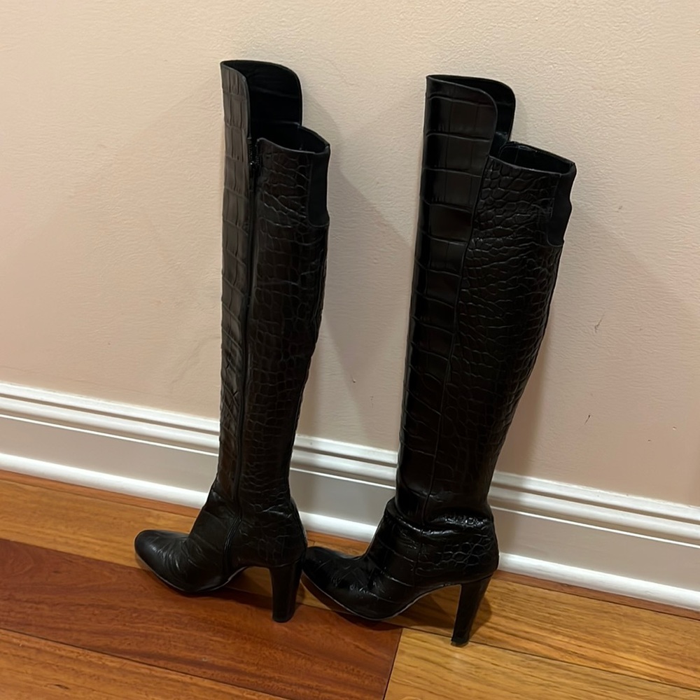 All leather knee-high boots. Full length zipper. Heel is 4”. Almost new!